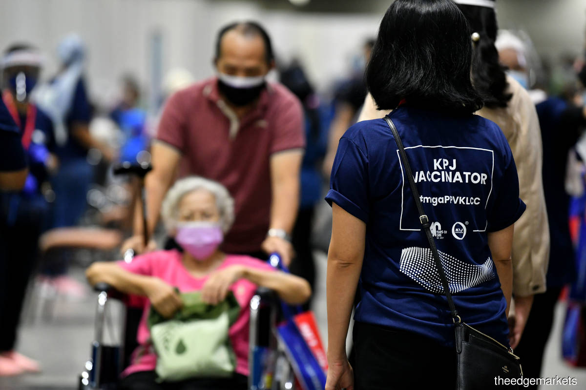 The Kuala Lumpur Convention Centre (KLCC) vaccination centre (PPV) as seen on June 7. 'They treated everyone in the queue lines. There was no favouritism or special treatment for orang kita, save for the ones with mild disabilities.' (Photo by Sam Fong/The Edge)